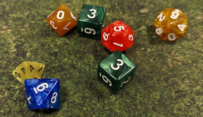 Yellow D4, Green D6, Blue D8, Orange D10 and Red D12.